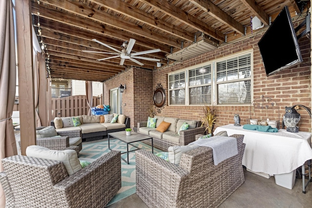 view of patio with outdoor lounge area and a ceiling fan