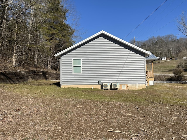 view of property exterior featuring a lawn