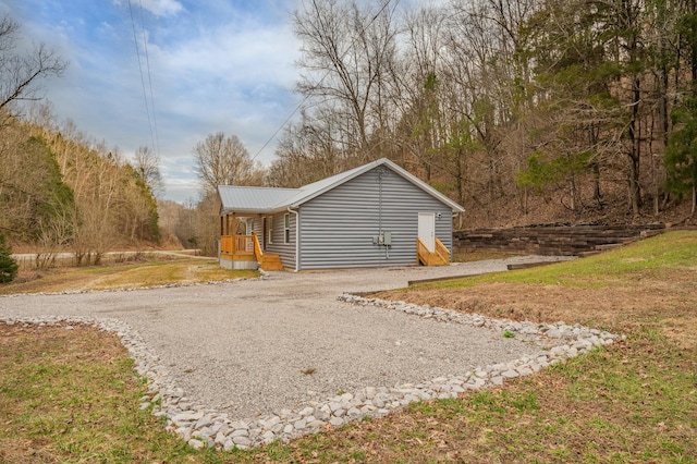 exterior space featuring a yard and a porch