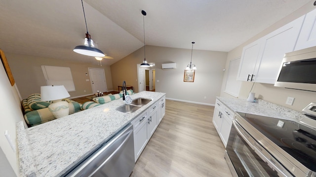 kitchen with pendant lighting, stainless steel appliances, and white cabinets