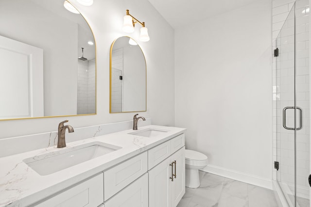 bathroom with vanity, toilet, and an enclosed shower