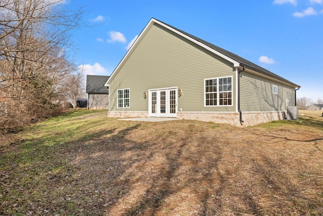 back of house with french doors, a yard, and central AC unit