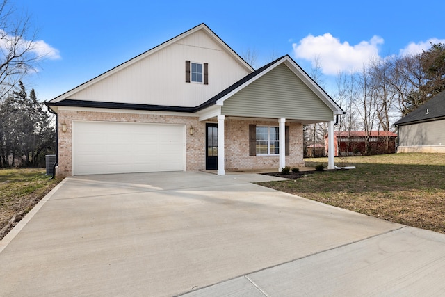 view of front facade featuring a garage, covered porch, and a front lawn