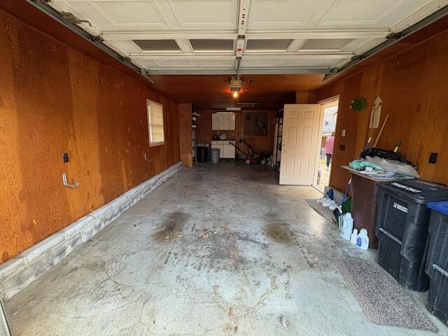 garage with wood walls