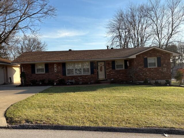 ranch-style home with a front lawn