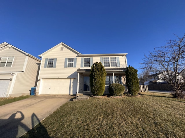 view of front property featuring a garage and a front yard