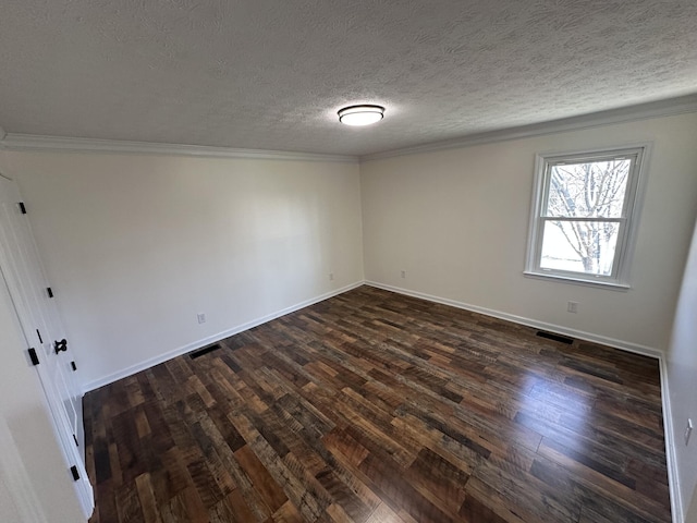 unfurnished room with crown molding, dark wood-type flooring, and a textured ceiling