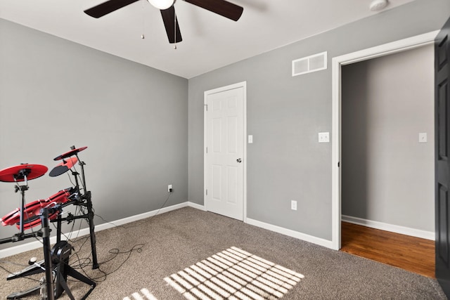 exercise room with carpet flooring