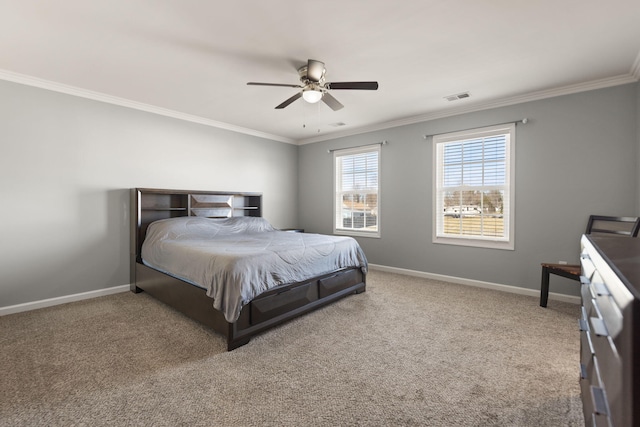 carpeted bedroom featuring ceiling fan and ornamental molding