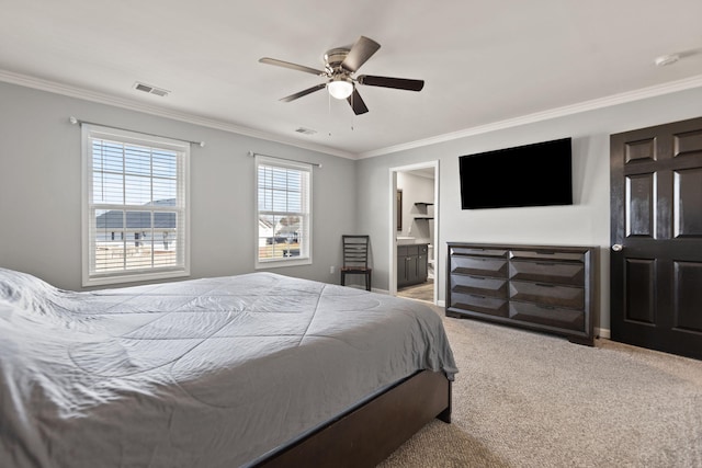 carpeted bedroom with ornamental molding, ceiling fan, and ensuite bathroom