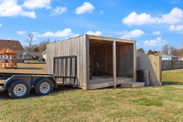 view of outdoor structure featuring a lawn