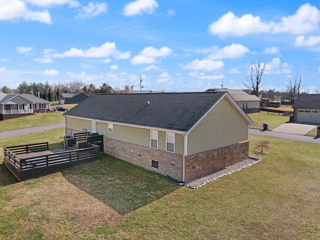 view of side of home featuring a yard