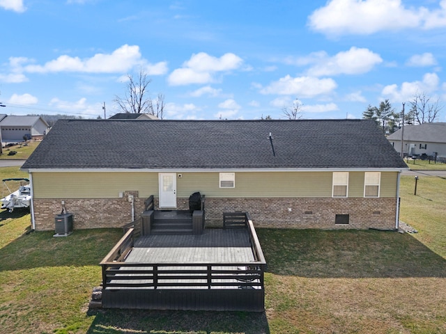 back of house with a yard and central air condition unit