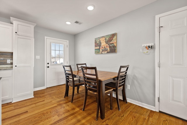 dining room featuring light hardwood / wood-style flooring