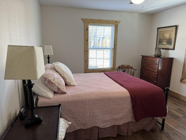 bedroom featuring dark hardwood / wood-style flooring