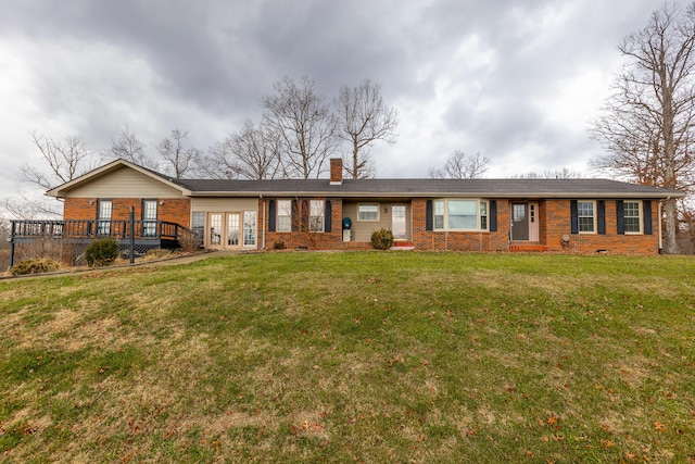 single story home with french doors, a front lawn, a chimney, and brick siding