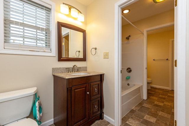 bathroom with shower / tub combination, vanity, toilet, and baseboards