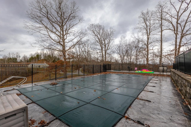 view of swimming pool featuring fence and a fenced in pool