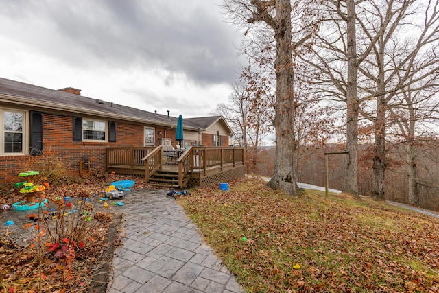 view of yard featuring a wooden deck