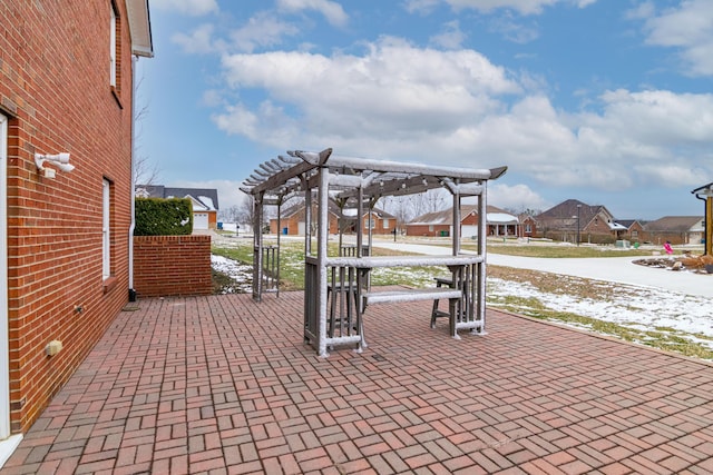 view of patio / terrace featuring a residential view and a pergola