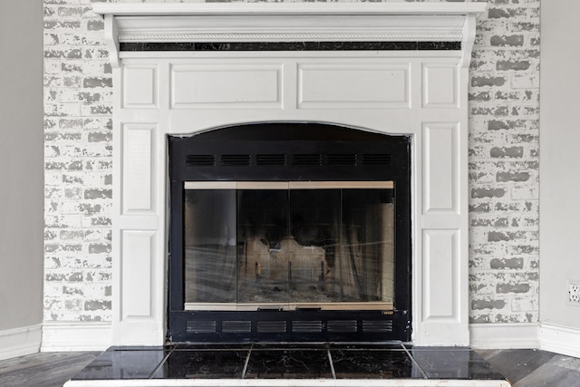 details featuring wood-type flooring and a fireplace