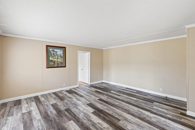 unfurnished room with dark hardwood / wood-style flooring, crown molding, and a textured ceiling