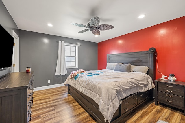 bedroom with hardwood / wood-style flooring and ceiling fan