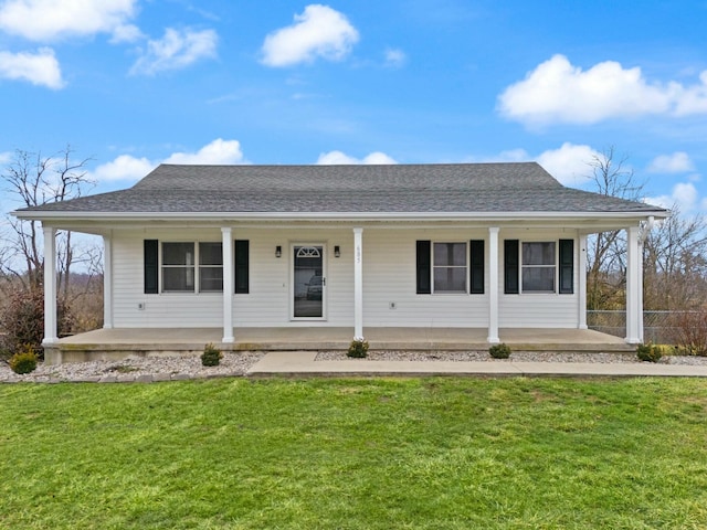 view of front of property with covered porch and a front lawn