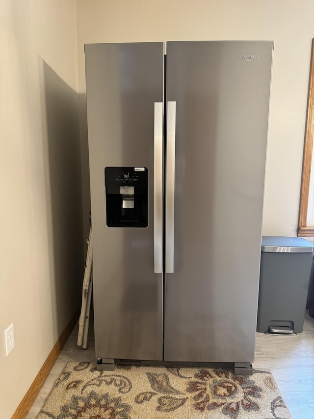 room details featuring stainless steel fridge