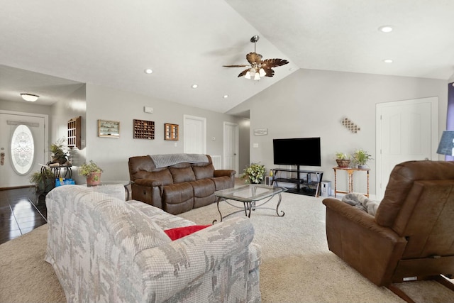 tiled living room featuring ceiling fan and vaulted ceiling