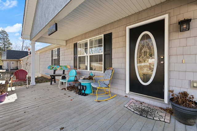 view of exterior entry featuring a porch