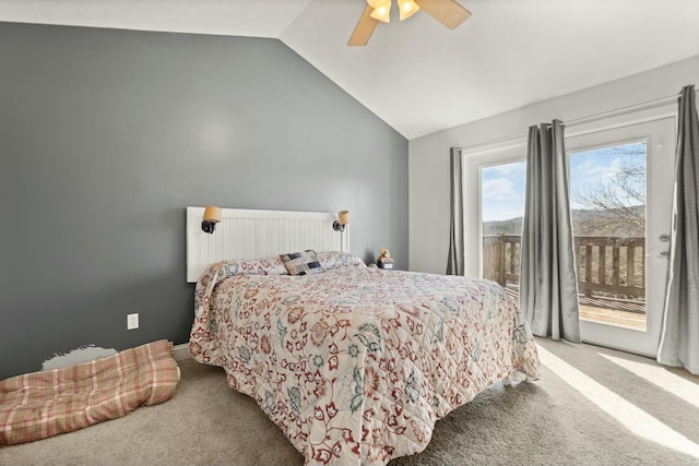 carpeted bedroom featuring lofted ceiling, access to exterior, and ceiling fan