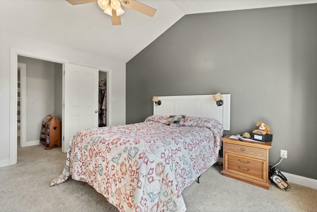 carpeted bedroom featuring vaulted ceiling and ceiling fan