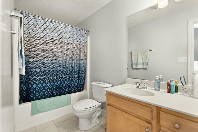 full bathroom featuring shower / tub combo with curtain, tile patterned floors, toilet, a textured ceiling, and vanity