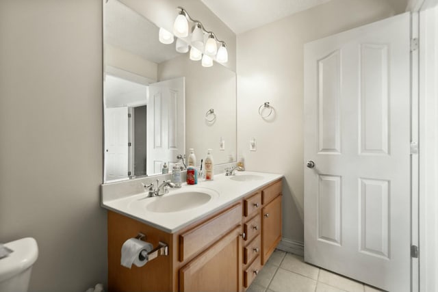 bathroom featuring tile patterned flooring and vanity