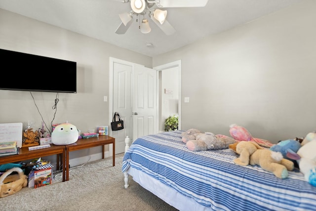 bedroom featuring light carpet and ceiling fan