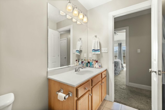 bathroom with vanity, tile patterned floors, and toilet