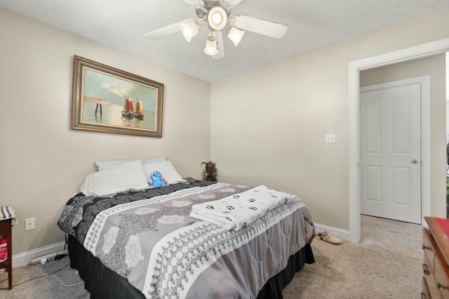 bedroom featuring light colored carpet and ceiling fan