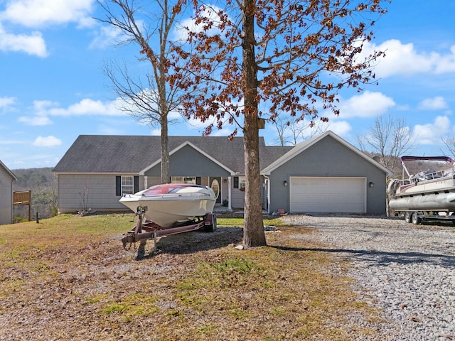 ranch-style home featuring a garage