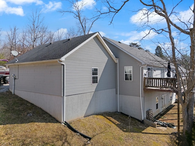 view of property exterior with a yard