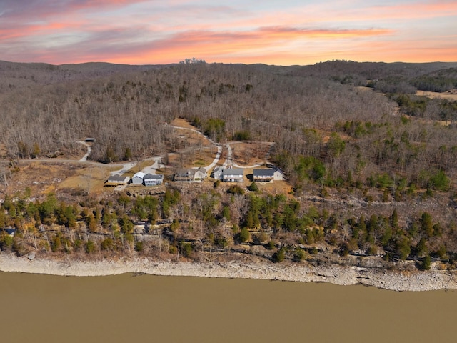 aerial view at dusk featuring a mountain view