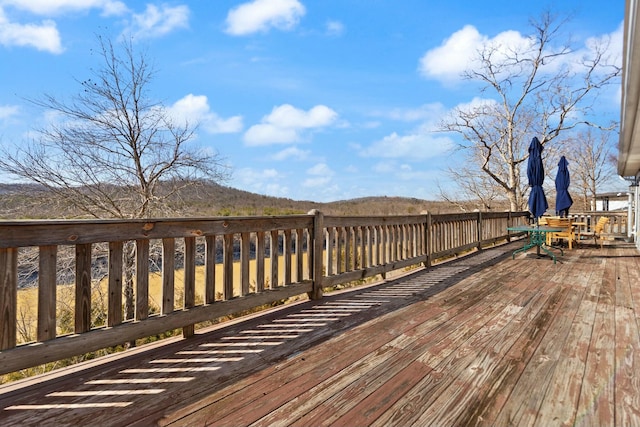 wooden terrace with a mountain view