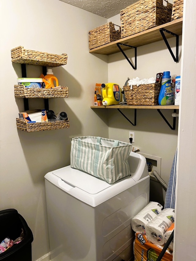 laundry area with washer / dryer