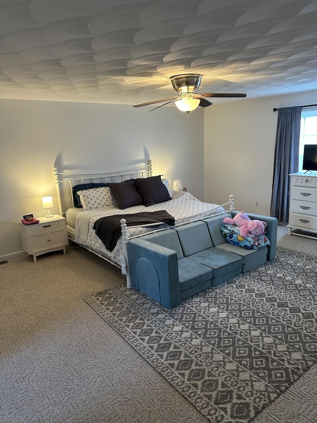 bedroom featuring ceiling fan and carpet flooring