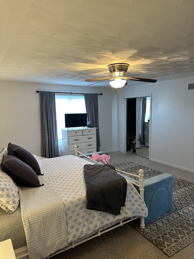 carpeted bedroom with ceiling fan