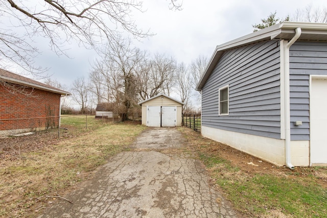 view of side of home with a storage unit