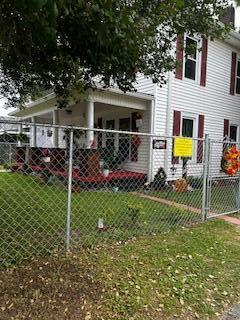 view of side of home featuring a yard