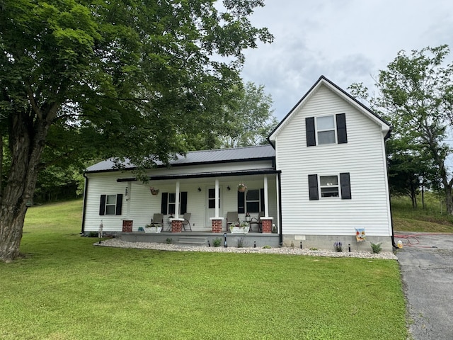 6002 Edmonton Rd, Columbia, KY 42728 - rear view of house with a porch, a yard, and metal roof