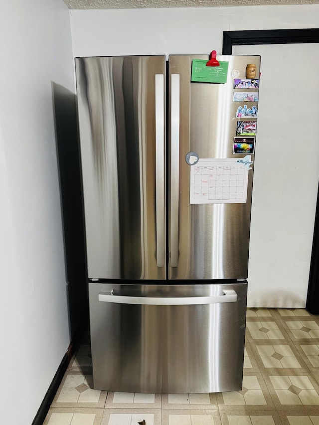 6002 Edmonton Rd, Columbia, KY 42728 - detailed view of freestanding refrigerator and light floors