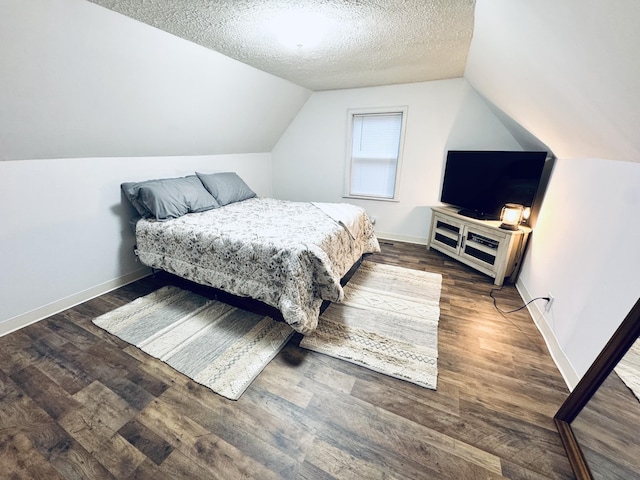 6002 Edmonton Rd, Columbia, KY 42728 - bedroom with lofted ceiling, a textured ceiling, wood finished floors, and baseboards